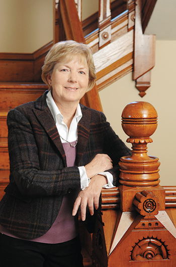 Marty Gross on the stairway in her Sherman Hill home.