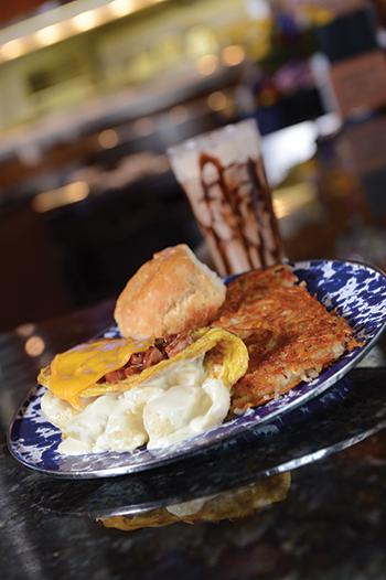 Jethro’s behemoth Kielbasa  Mac-a-Doodle omelet features smoked sausage and macaroni and cheese. The Double Chocolate Jacked-Up Java (background) is both stimulating and soothing. 