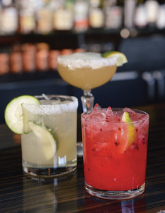 Signature cocktails, from left, the cucumber habanero margarita, the El Mayor margarita and Lavender Caipirinha.