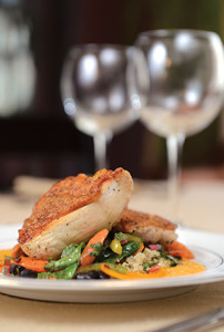 Flavorful and crispy pan-roasted chicken starred at a spring Food for Thought dinner. Sautéed cabbage, peppers and carrots grown at the Wallace Centers of Iowa Farm finished the dish.