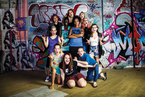 Rae Fehring (center) with Girls Rock! Des Moines camp participants. Fehring says she wants to “reach girls as young as 5 years old and help them find their voice and feel empowered.”