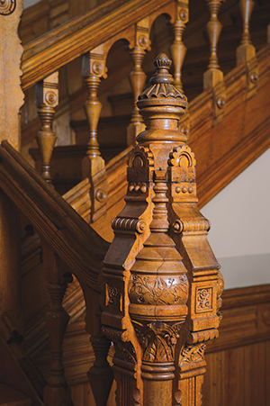 The lustrous patina of time embellishes ornamentation on this newel post and balustrade in the 1884 Sheuerman House, now owned by York Taenzer.