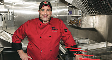 Shon Bruellman, on board his Big Red Food Truck, enjoys his flexible work schedule and the camaraderie among food truck operators.