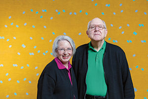 Married 41 years, Trudy and Tom Dolezal are the museum’s only husband-and-wife team. Larry Poons, “Han-San Cadence” (1963); acrylic and fabric dye on canvas,  72 1/2 x 144 7/8 x 2 5/16 inches.